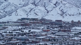 AX124_016E - 5.5K aerial stock footage of University of Utah Hospital at Sunrise in Winter, Salt Lake City