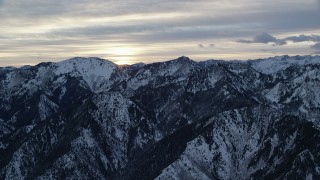 AX124_034 - 5.5K aerial stock footage of snowy Wasatch Range mountains at Sunrise in Utah