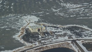 AX125_298 - 5.5K aerial stock footage orbit the Saltair Pavilion with winter snow near Magna, Utah