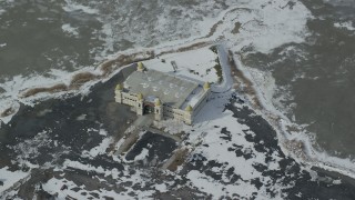 AX125_300 - 5.5K aerial stock footage of circling the Saltair Pavilion with winter snow near Magna, Utah