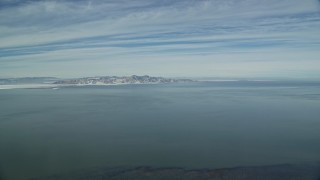 AX125_302E - 5.5K aerial stock footage pan across a wide view of the Great Salt Lake in wintertime, Utah