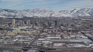 AX126_008 - 5.5K stock footage aerial video of the downtown area of Salt Lake City with winter snow in Utah