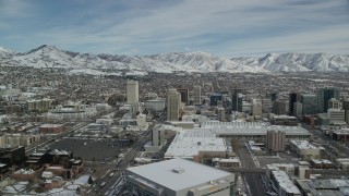 AX126_012 - 5.5K stock footage aerial video orbit of snowy Downtown Salt Lake City, Utah, in winter