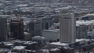 AX126_040E - 5.5K aerial stock footage of office buildings in Downtown Salt Lake City, Utah, in winter