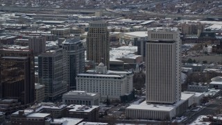 AX126_042 - 5.5K aerial stock footage circle office buildings in Downtown Salt Lake City in winter, Utah