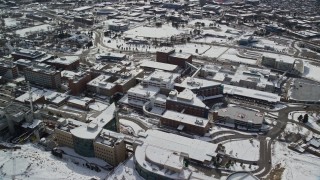 AX126_053E - 5.5K aerial stock footage of circling University of Utah hospital buildings in wintertime, Salt Lake City