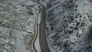 AX126_074 - 5.5K aerial stock footage bird's eye view of Interstate 80 through the mountains and approach Mountain Dell Dam, Utah