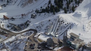AX126_106 - 5.5K aerial stock footage orbit the aerials pool at Utah Olympic Park with winter snow, Park City