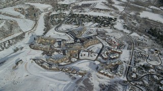 AX126_114 - 5.5K aerial stock footage orbiting hotels at Canyons Resort in Park City in wintertime, Utah