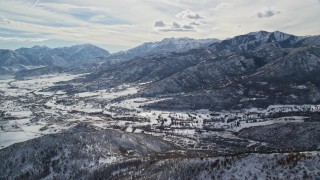 AX126_199 - 5.5K aerial stock footage approach the small town of Midway with winter snow in Utah