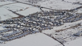 AX126_201E - 5.5K aerial stock footage of tract homes in a small town neighborhood in Midway, Utah