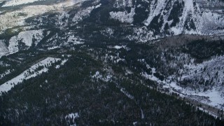 AX126_274E - 5.5K aerial stock footage of evergreen forests and winter snow in the Wasatch Range of Utah