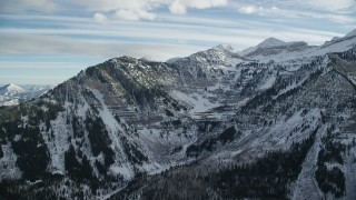 AX126_276 - 5.5K aerial stock footage of Mount Timpanogos with winter snow in the Wasatch Range of Utah