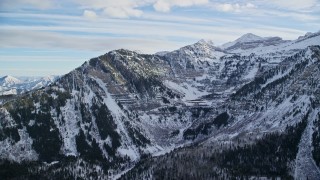 AX126_276E - 5.5K aerial stock footage of Mount Timpanogos with winter snow in the Wasatch Range of Utah