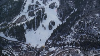 AX126_299E - 5.5K aerial stock footage orbit ski lifts and runs at the Sundance Mountain Resort with winter snow in Utah
