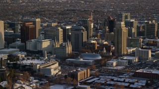 AX127_120 - 5.5K aerial stock footage of Salt Lake Temple, Tabernacle, Assembly Hall and Downtown Salt Lake City, Utah at sunset in winter