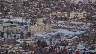 AX127_161E - 5.5K aerial stock footage approach west side of Utah State Capitol with winter snow at sunset, Salt Lake City