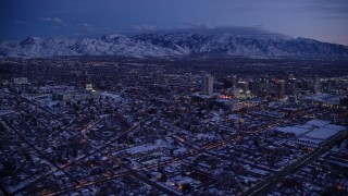 AX128_048E - 5.5K aerial stock footage wide orbit of Downtown Salt Lake City seen from the northwest near the capitol in winter at twilight, Utah