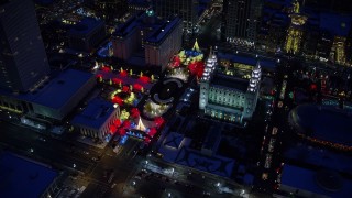 AX128_083E - 5.5K aerial stock footage orbit Salt Lake Temple with snow and Christmas lights at night, Downtown Salt Lake City, Utah