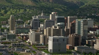 AX129_016 - 5.5K aerial stock footage of flying by city buildings, revealing Utah State Capitol, Downtown Salt Lake City, Utah