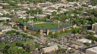 AX129_025 - 5.5K aerial stock footage of Spring Mobile Ballpark during a baseball game, Salt Lake City, Utah