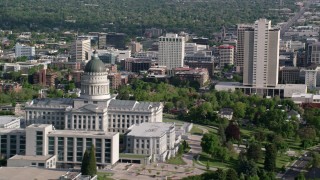 AX129_042 - 5.5K stock footage aerial video of flying by Utah State Capitol, city buildings in Downtown Salt Lake City, Utah