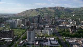 AX129_051 - 5.5K stock footage aerial video of approaching Grand America Hotel, city buildings, Downtown Salt Lake City, Utah
