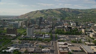 AX129_051E - 5.5K aerial stock footage fly over city buildings, approach Utah State Capitol, Downtown Salt Lake City, Utah