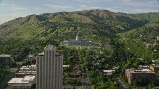 AX129_055E - 5.5K aerial stock footage of approaching Utah State Capitol, tilt to bird's eye view, Salt Lake City, Utah