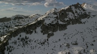 AX129_122E - 5.5K aerial stock footage of Lone Peak in the Wasatch Range, Utah