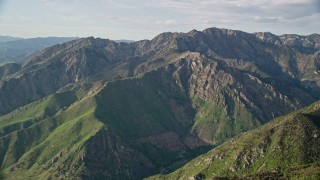 AX129_133E - 5.5K aerial stock footage of passing by Mount Olympus in the Wasatch Range, Mount Olympus, Utah