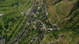 AX129_137E - 5.5K aerial stock footage of a bird's eye of suburbs beside I-215, Salt Lake City, Utah