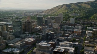 AX129_146E - 5.5K aerial stock footage of city buildings, convention center, Utah State Capitol, Downtown Salt Lake City, Utah