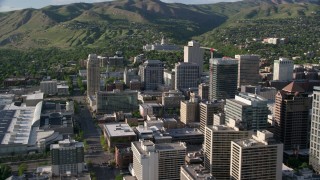 AX129_147 - 5.5K stock footage aerial video pass city buildings, convention center, state capitol, Downtown Salt Lake City, Utah