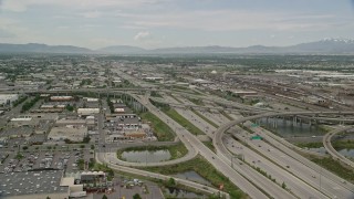 AX130_010E - 5.5K aerial stock footage approach and fly over I-80 and I-15 interchange, Salt Lake City, Utah