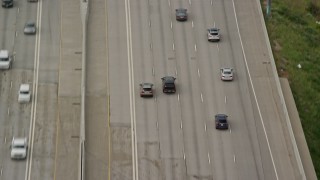 AX130_013E - 5.5K aerial stock footage track a black SUV on I-15, light traffic, Salt Lake City, Utah