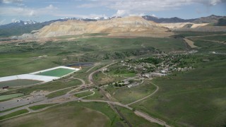 AX130_029 - 5.5K aerial stock footage of approaching Bingham Canyon Mine (Kennecott Copper Mine), Copperton, Utah