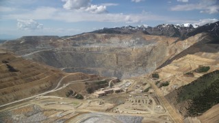 AX130_037 - 5.5K aerial stock footage of orbiting Bingham Canyon Mine (Kennecott Copper Mine), Utah
