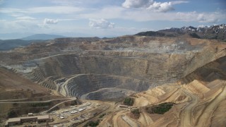AX130_039 - 5.5K aerial stock footage of circling Bingham Canyon Mine (Kennecott Copper Mine), Utah