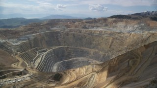 AX130_040 - 5.5K aerial stock footage circle the Bingham Canyon Mine (Kennecott Copper Mine), Utah