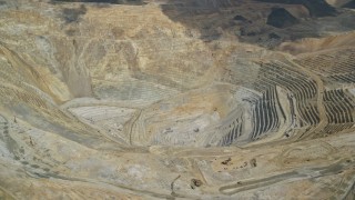AX130_052E - 5.5K aerial stock footage of a view of the bottom of Bingham Canyon Mine (Kennecott Copper Mine), Utah