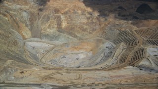 AX130_053 - 5.5K aerial stock footage of a view of the bottom of Bingham Canyon Mine (Kennecott Copper Mine), Utah