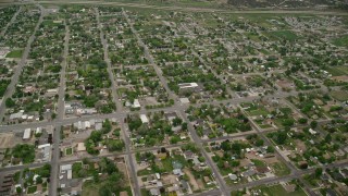 AX130_119E - 5.5K aerial stock footage of orbiting neighborhoods in a small town, Nephi, Utah