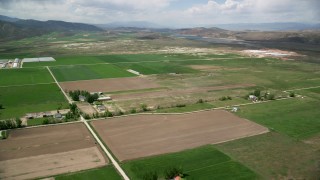 AX130_147 - 5.5K aerial stock footage of flying over farmland near Gunnison Reservoir, Manti, Utah
