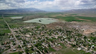 AX130_162 - 5.5K stock footage aerial video of flying over rural town and approaching Redmond Lake, Redmond, Utah