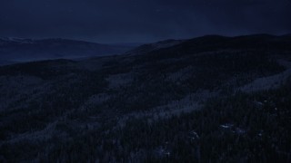 AX130_200_DFN - Aerial stock footage of 4K day for night color corrected aerial footage fly over mountain slopes, evergreen forest and aspen trees, Fishlake National Forest, Utah