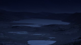 AX130_223_DFN - Aerial stock footage of 4K day for night color corrected aerial footage of flying by the Quaking Giant aspen tree colony, Pando, Fish Lake, Utah