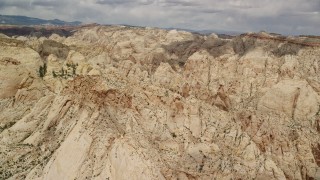 AX130_279E - 5.5K aerial stock footage of a view of the Waterpocket Fold rock formations, Capitol Reef National Park, Utah