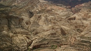 AX130_297 - 5.5K aerial stock footage of passing part of the Waterpocket Fold rock formations, Capitol Reef National Park, Utah