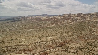 AX130_300E - 5.5K aerial stock footage of approaching the Waterpocket Fold rock formations, Capitol Reef National Park, Utah